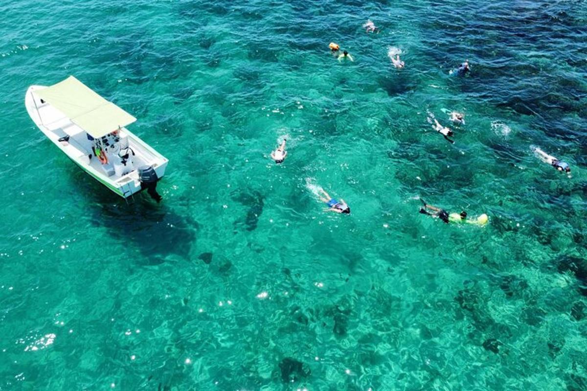 a group of people on a boat in the water