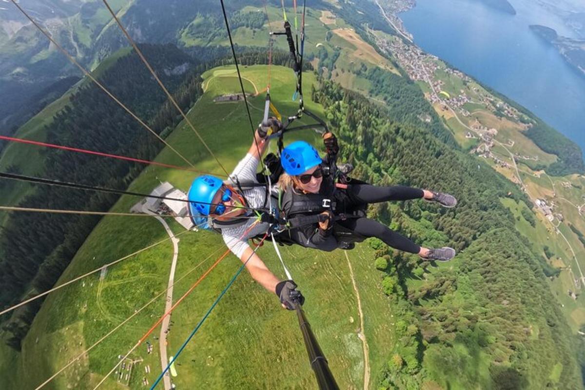 a man hanging from a parachute in the air