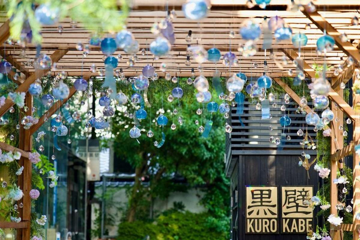 a string of chinese lights hanging from a pergola