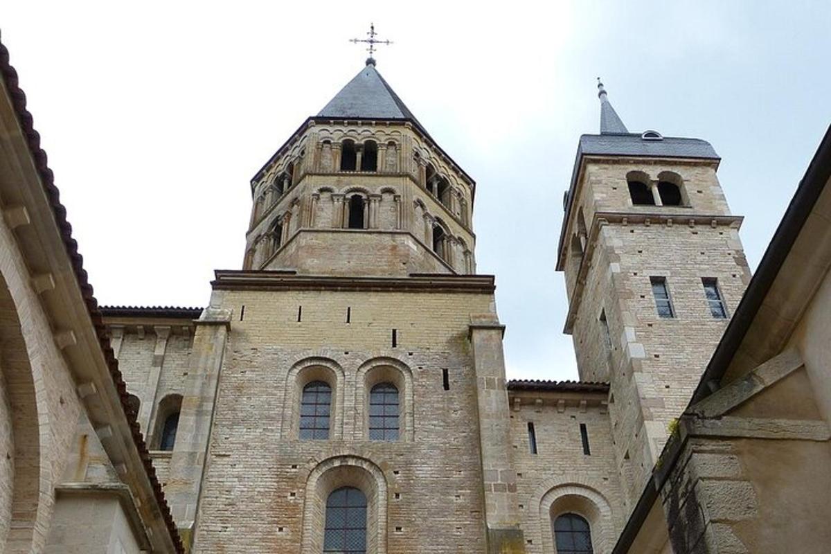 an old building with two towers on top of it