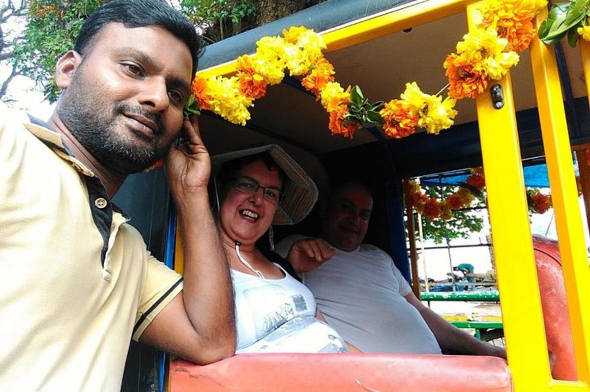 two men and a woman riding in a roller coaster