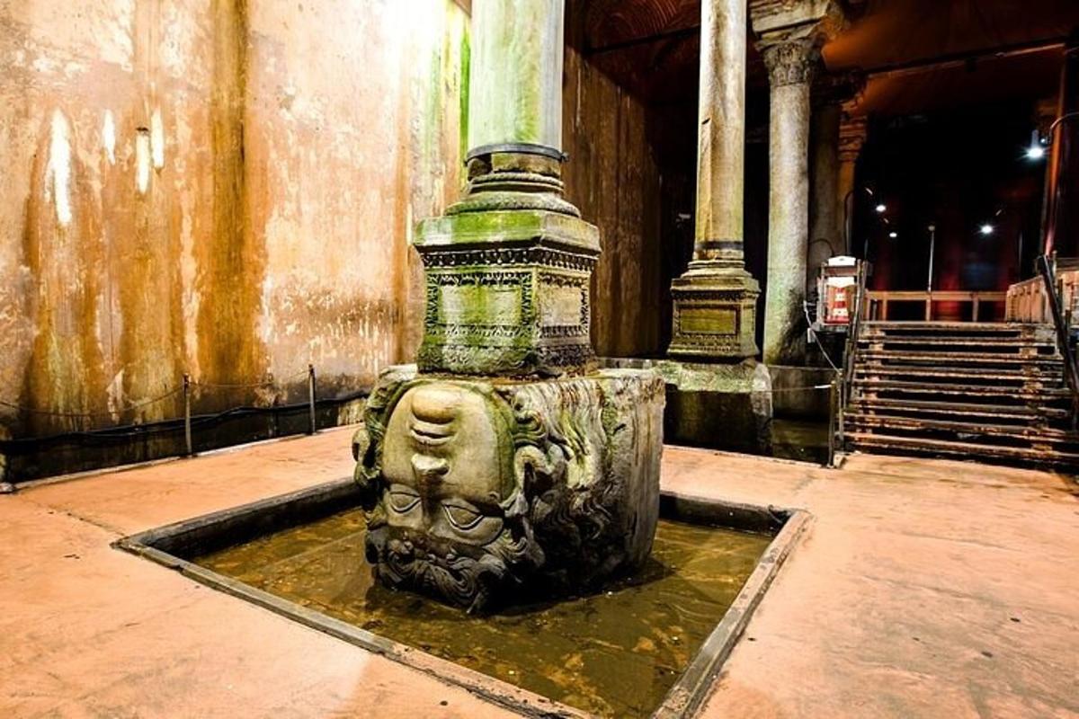 a fountain with a statue in a building