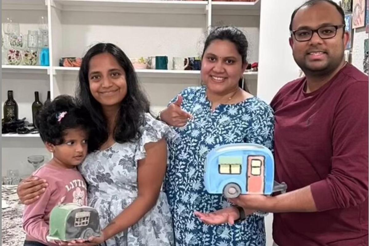 a family poses for a picture with a toy truck