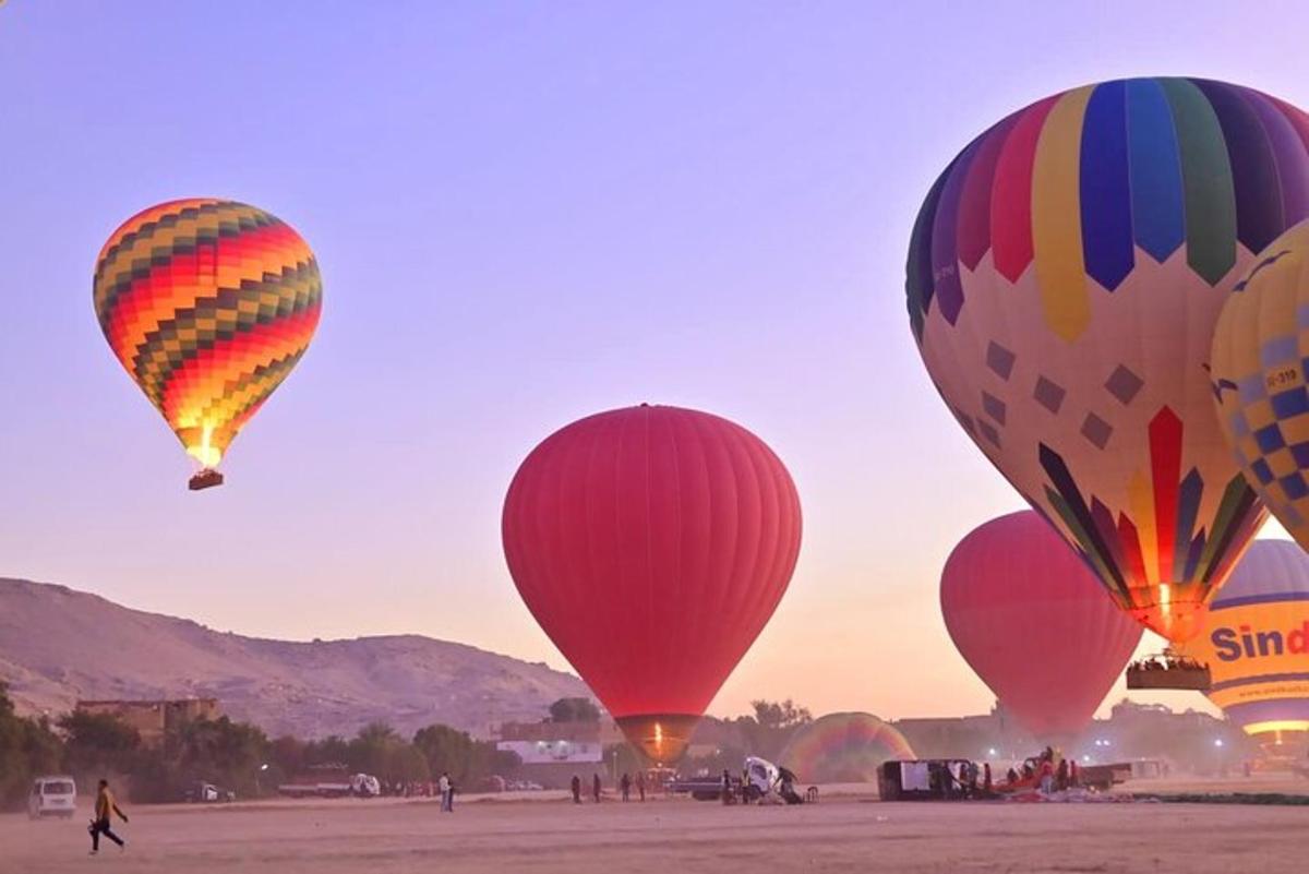 a group of hot air balloons flying in the sky