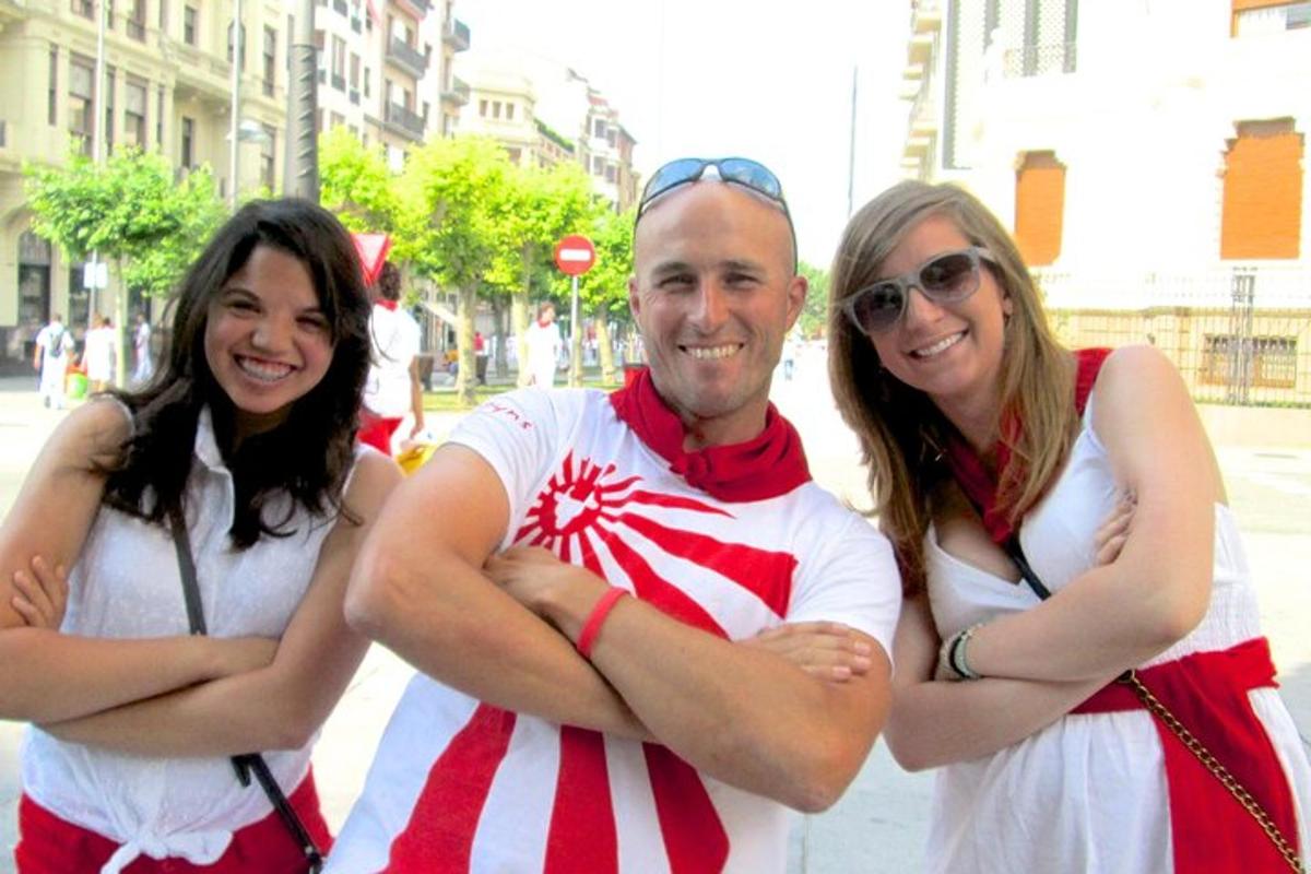 a man and two women are posing for a picture