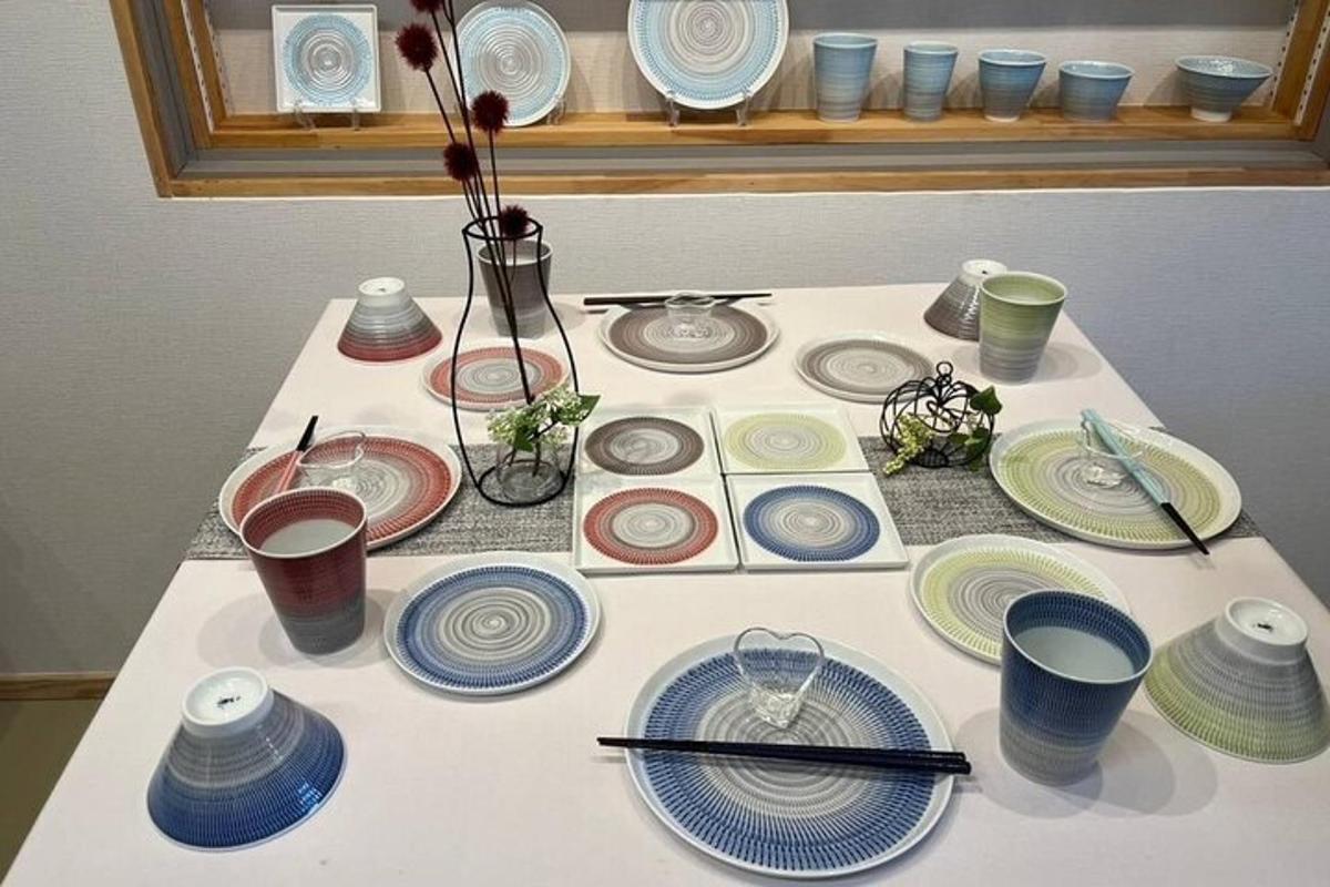 a table with plates and chopsticks on top of it