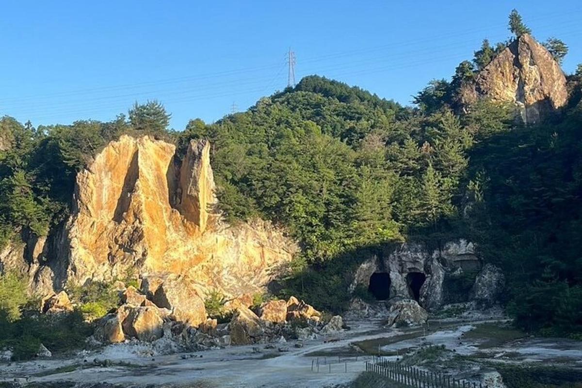a view of a mountain with rocks and trees