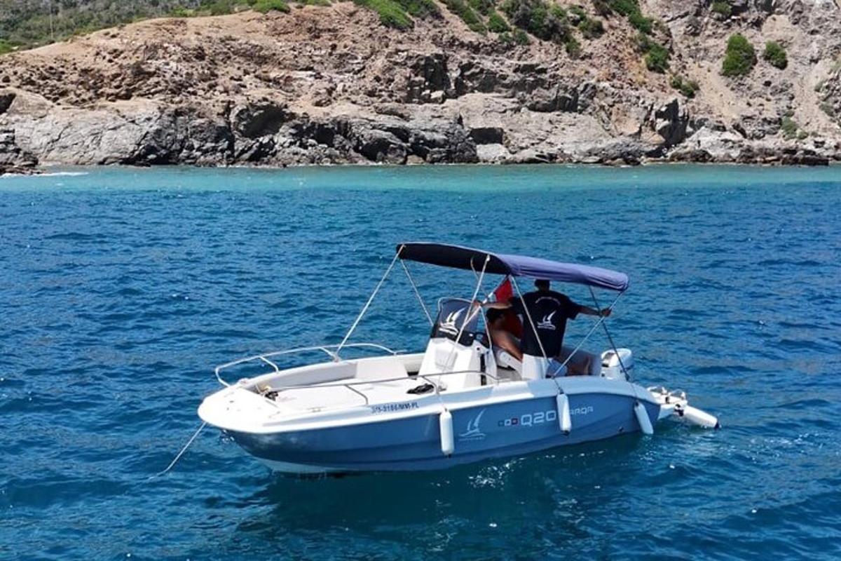 a man and a dog in a boat in the water