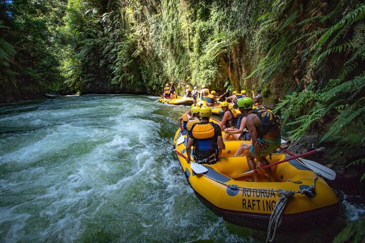 a group of people in a raft in a river