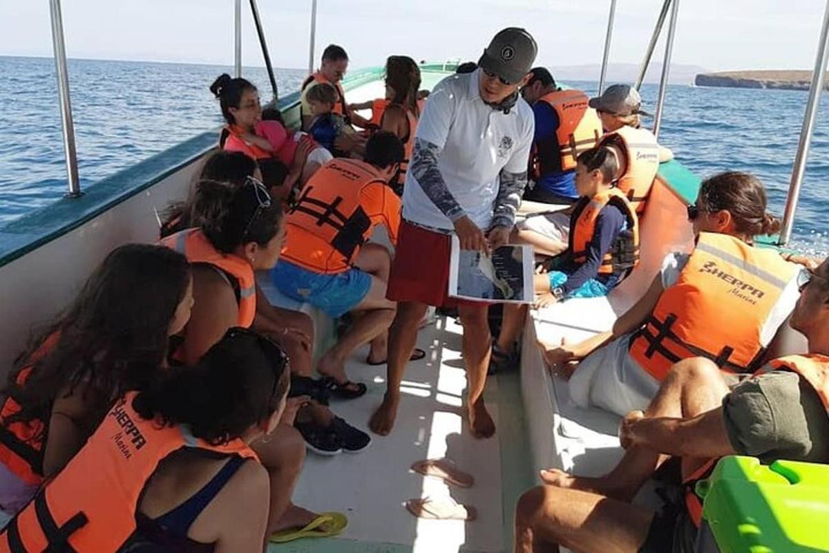 a group of people on a boat in the water
