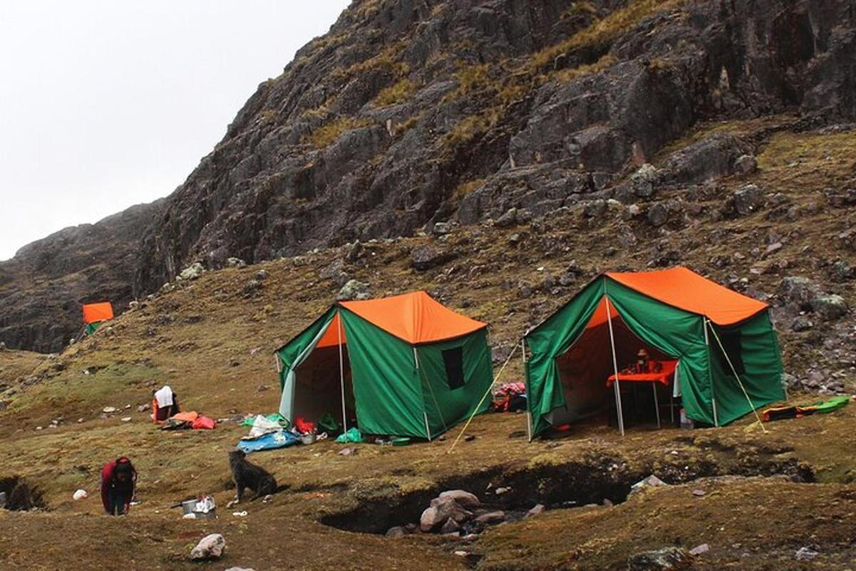 two tents on the side of a mountain