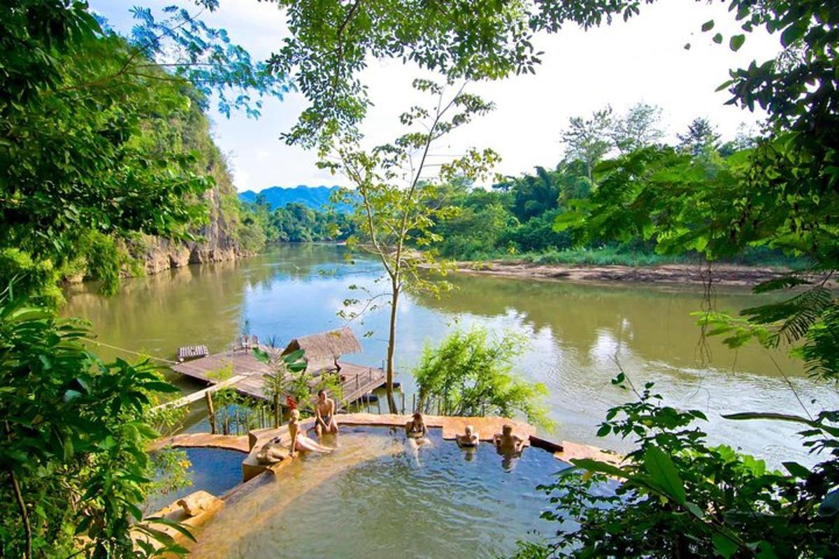 a river with a group of people in the water