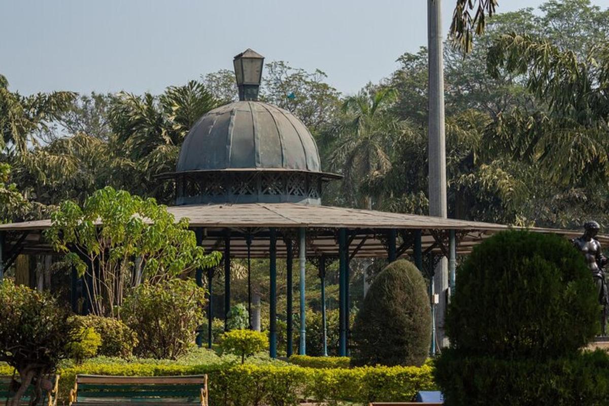 a gazebo with a dome in a park