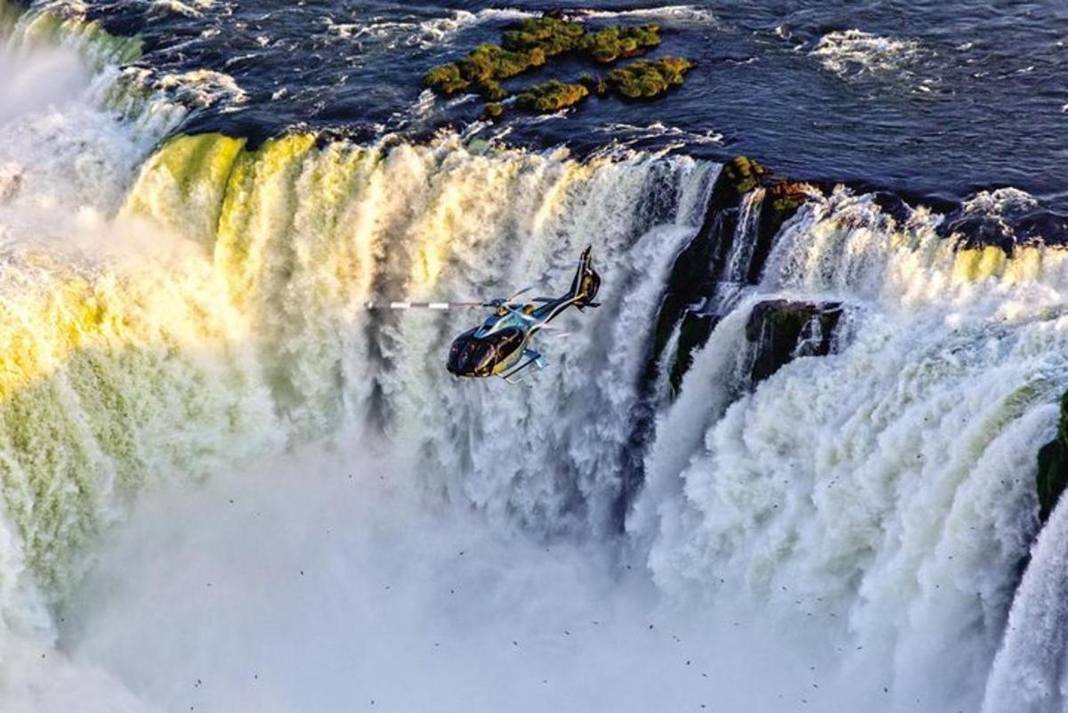 a man is in the middle of a waterfall