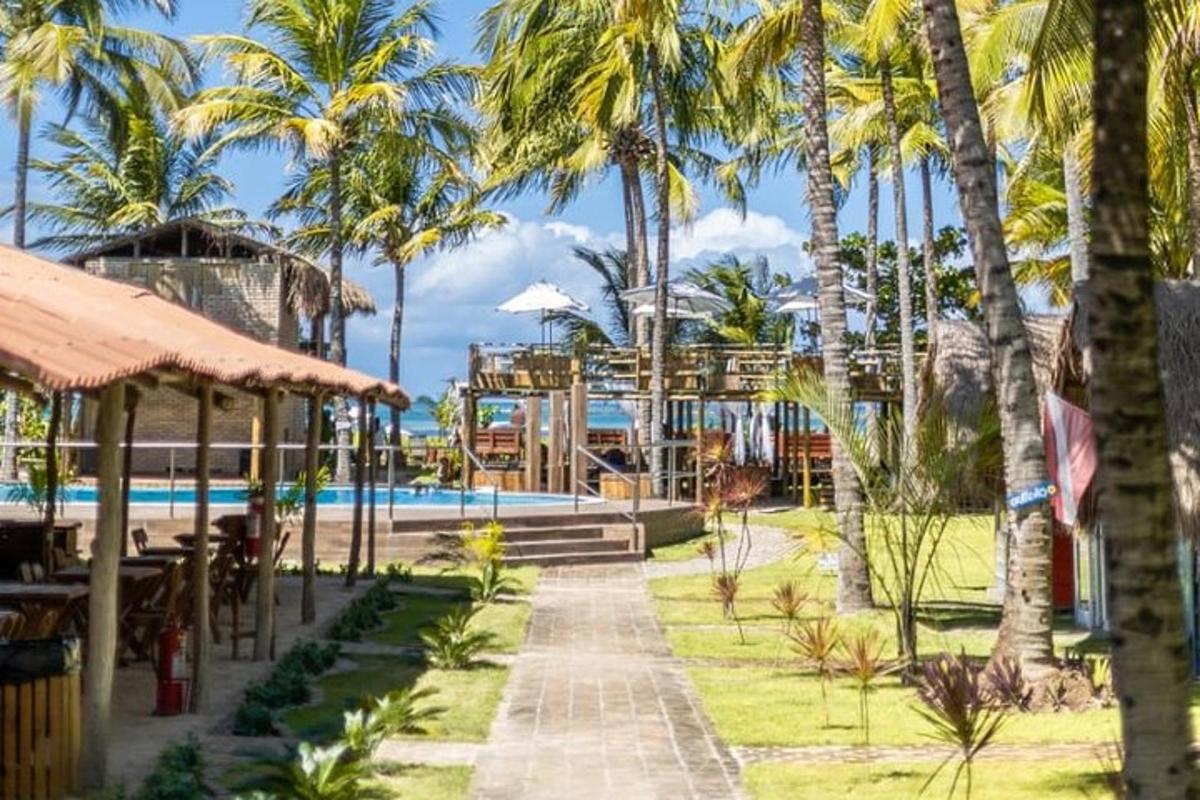 a resort with a swimming pool and palm trees