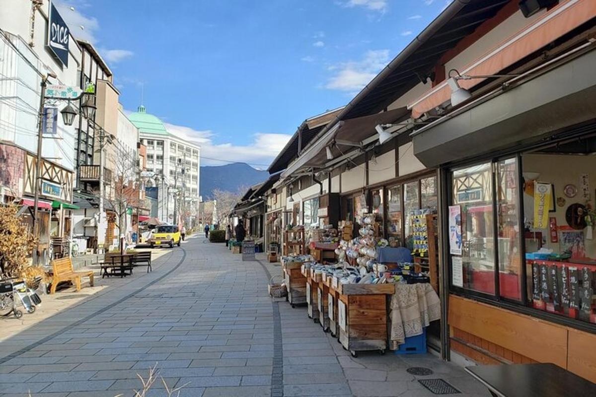 a street with a bunch of shops in a city