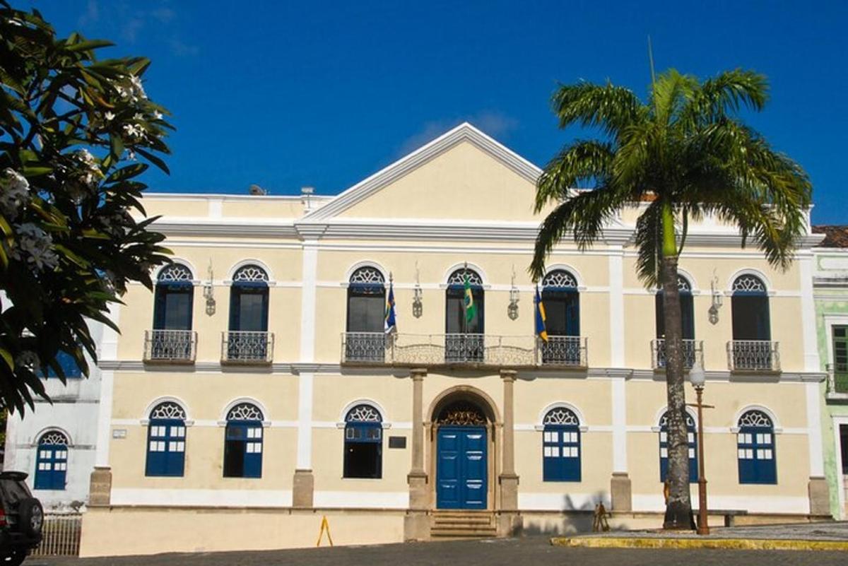 a building with a palm tree in front of it