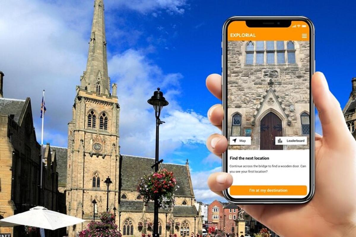 a person holding up a cell phone in front of a church