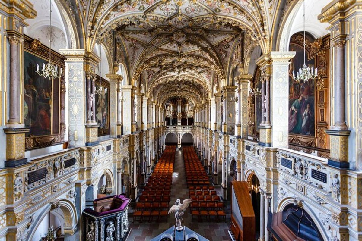 a hallway in a building with paintings on the walls