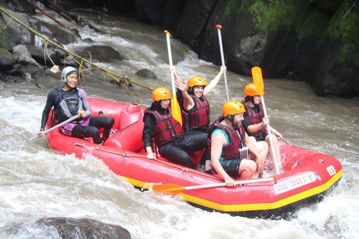 a group of people in a raft in a river