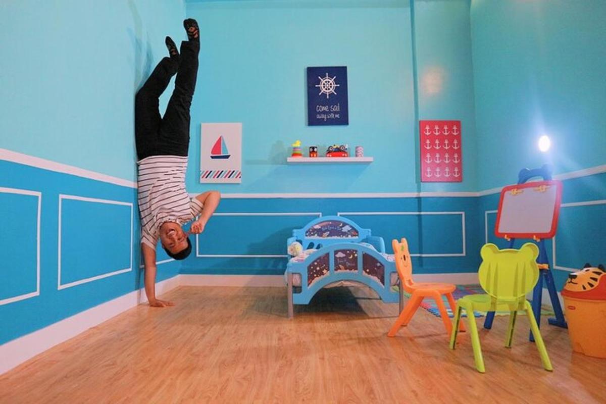 a person doing a handstand in a play room