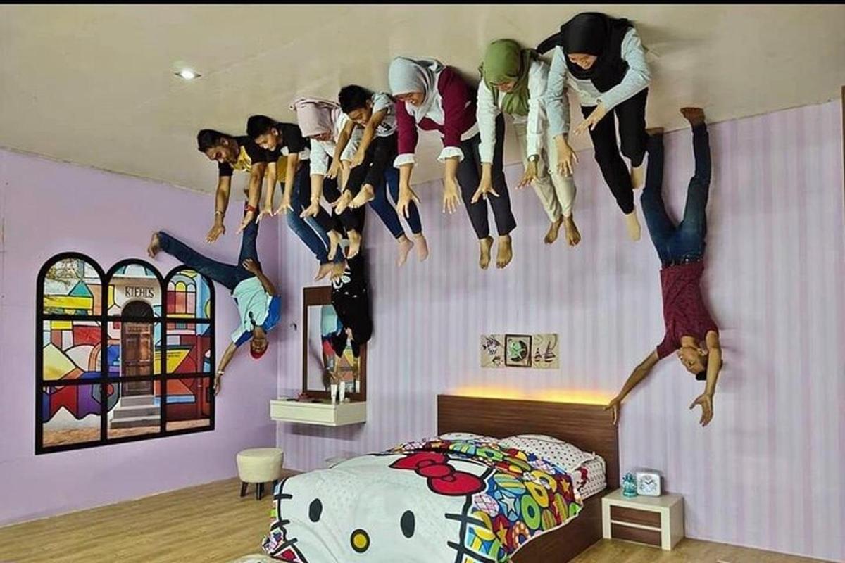 a bedroom with a bunch of dolls hanging on the wall