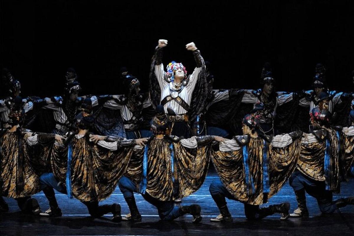 a group of performers in costumes on the stage
