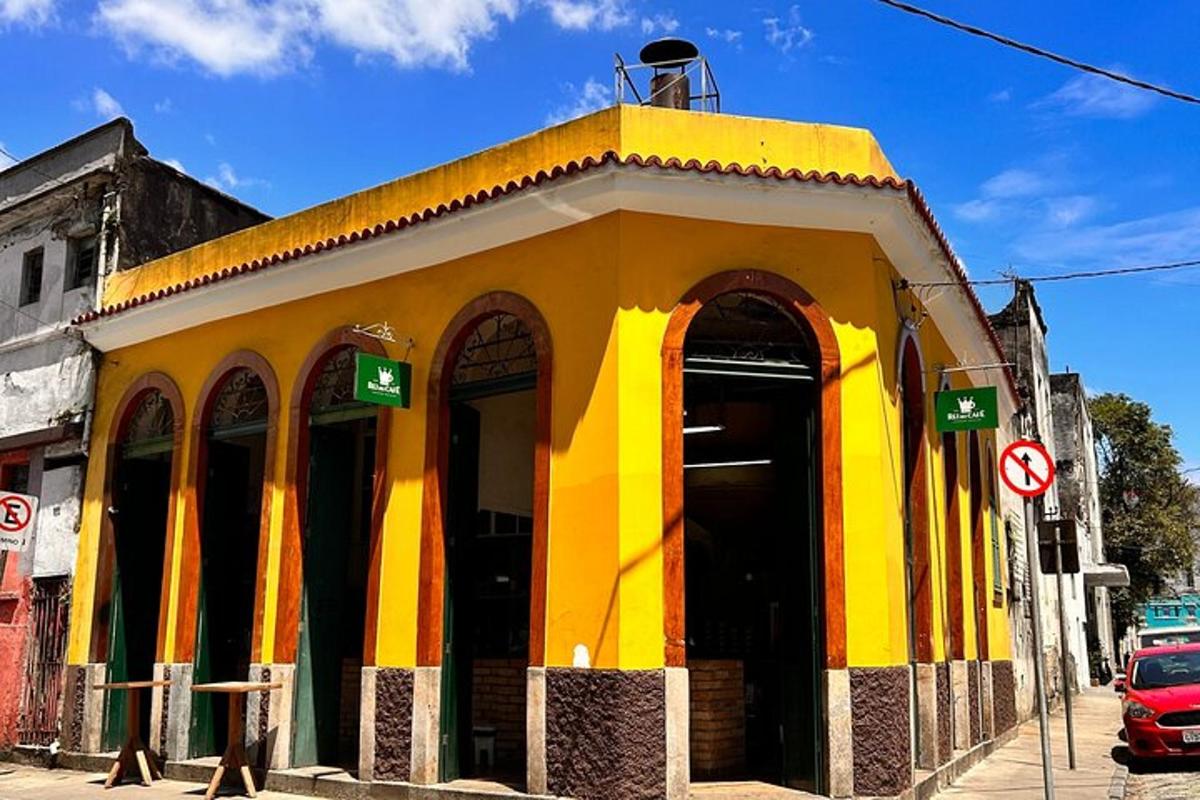 a yellow building on the side of a street