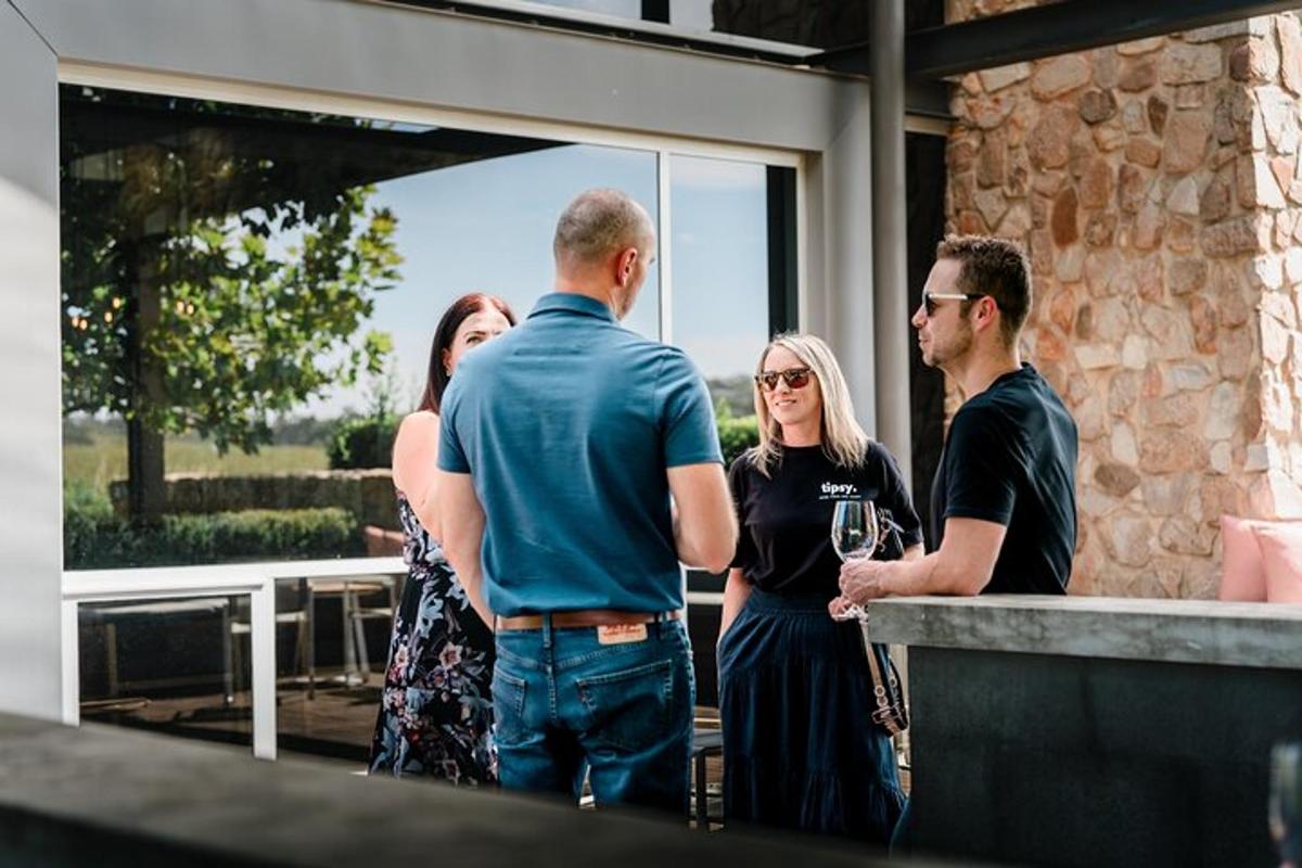 a group of people standing around a bar