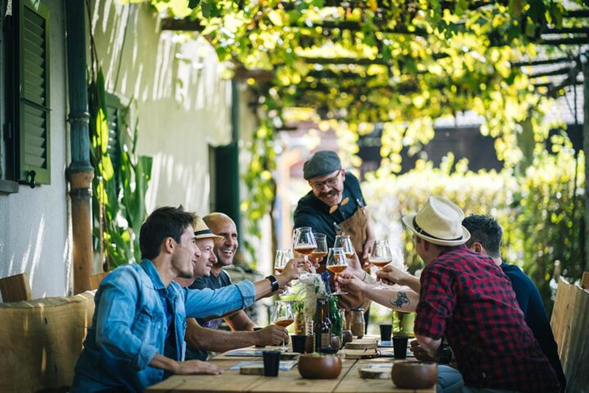 a group of people sitting around a table drinking wine