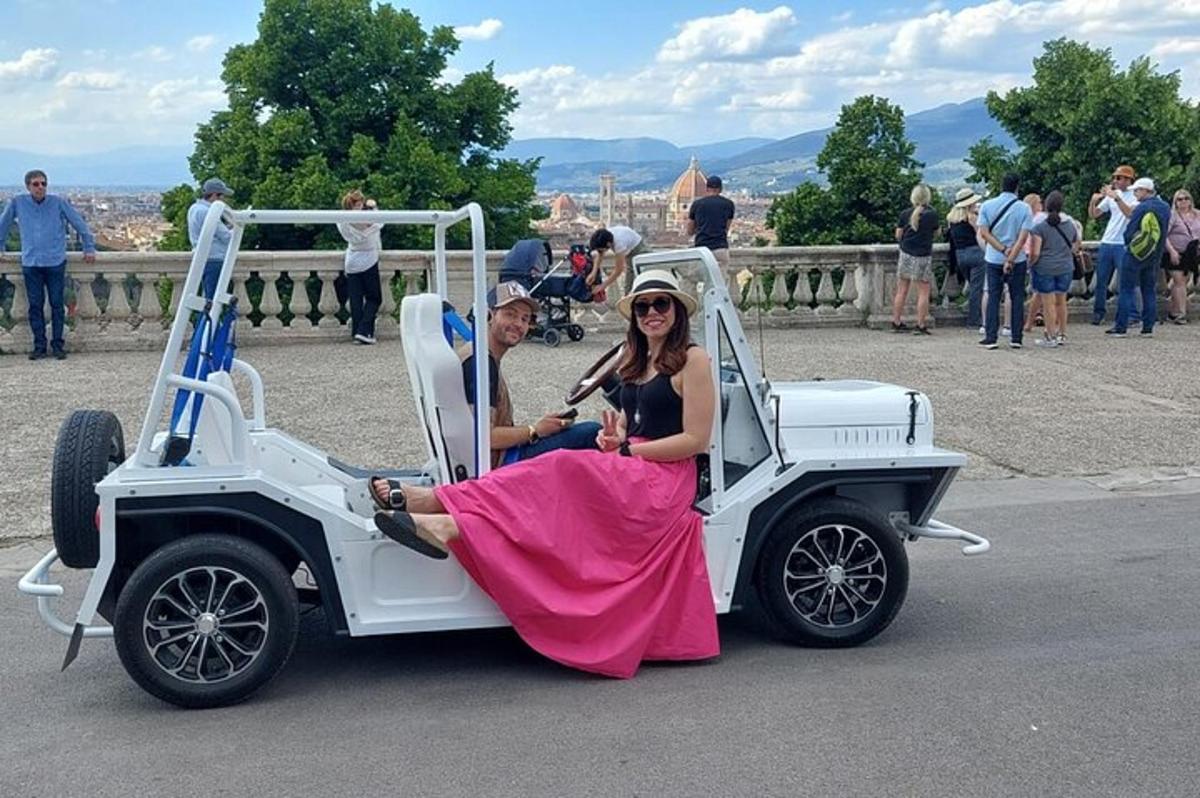 a man and a woman sitting in a car