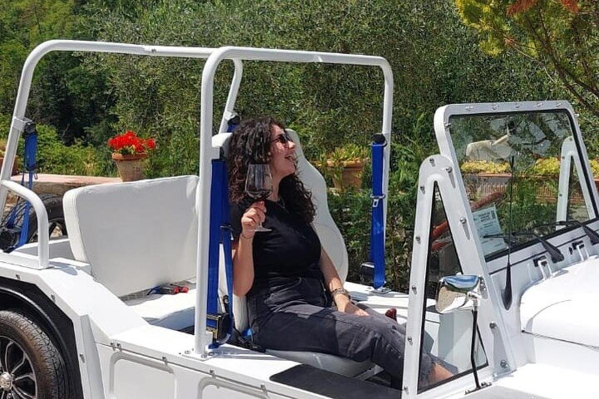 a woman sitting in the back of a golf cart