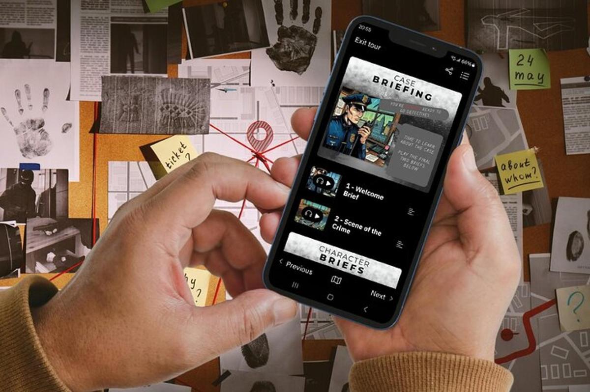 a person holding a cell phone in their hand