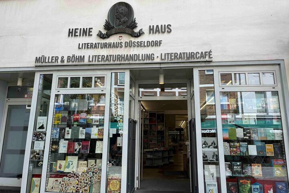 a book store with a sign above the doors