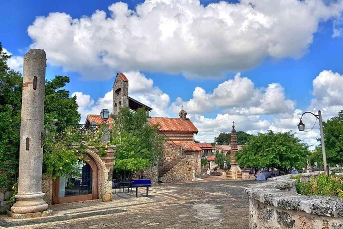 an old stone building with a tower on a street
