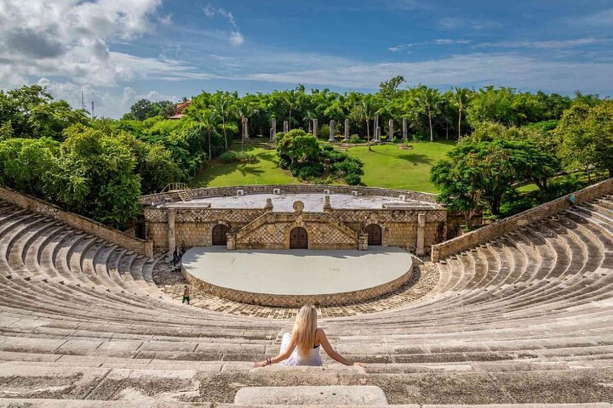 a woman sitting in an amphitheater