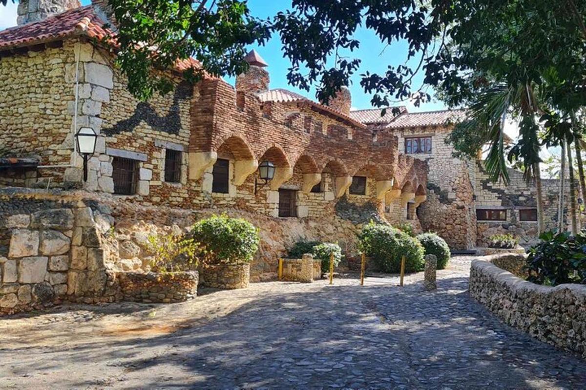 an old stone building with a tree in front of it