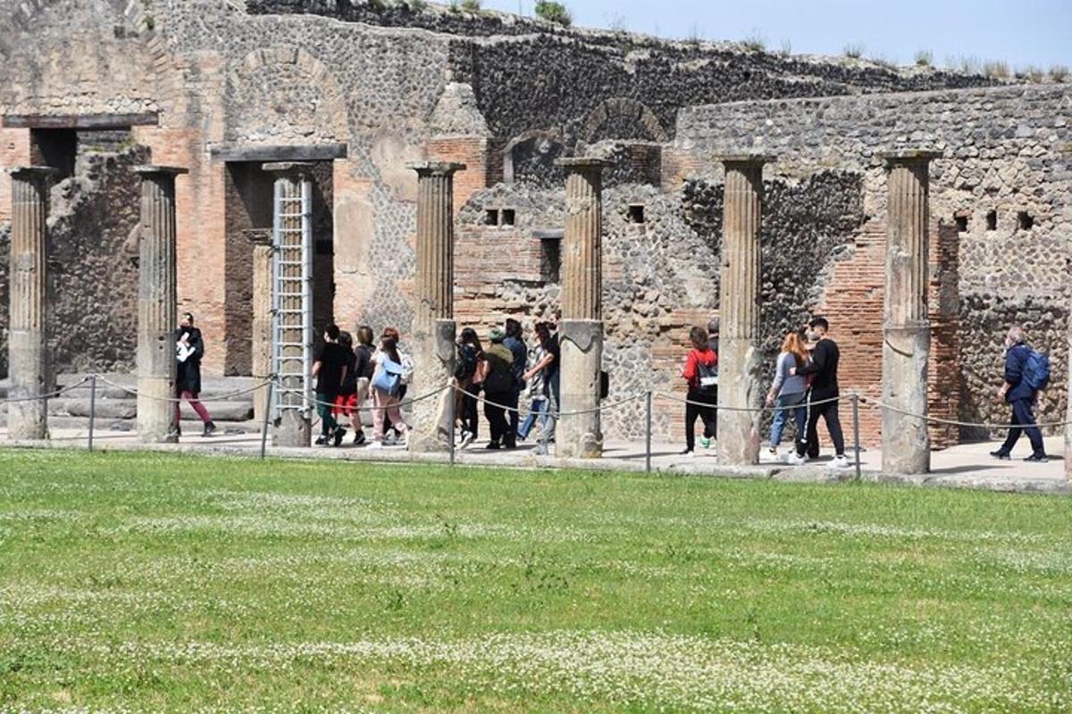 a group of people walking in front of a building