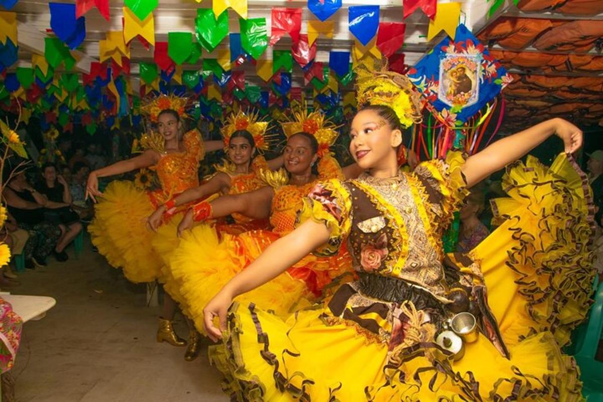 a group of women in yellow costumes sitting in a row