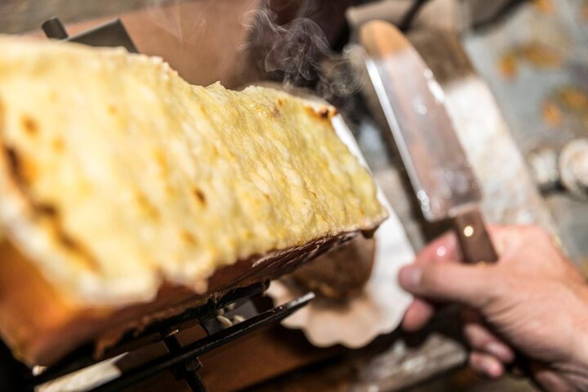 a person is cutting a sandwich with a knife