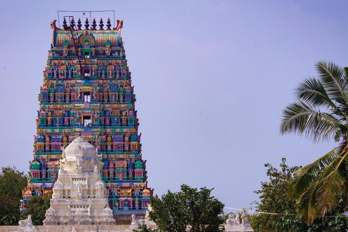 a tall building with people sitting on top of it