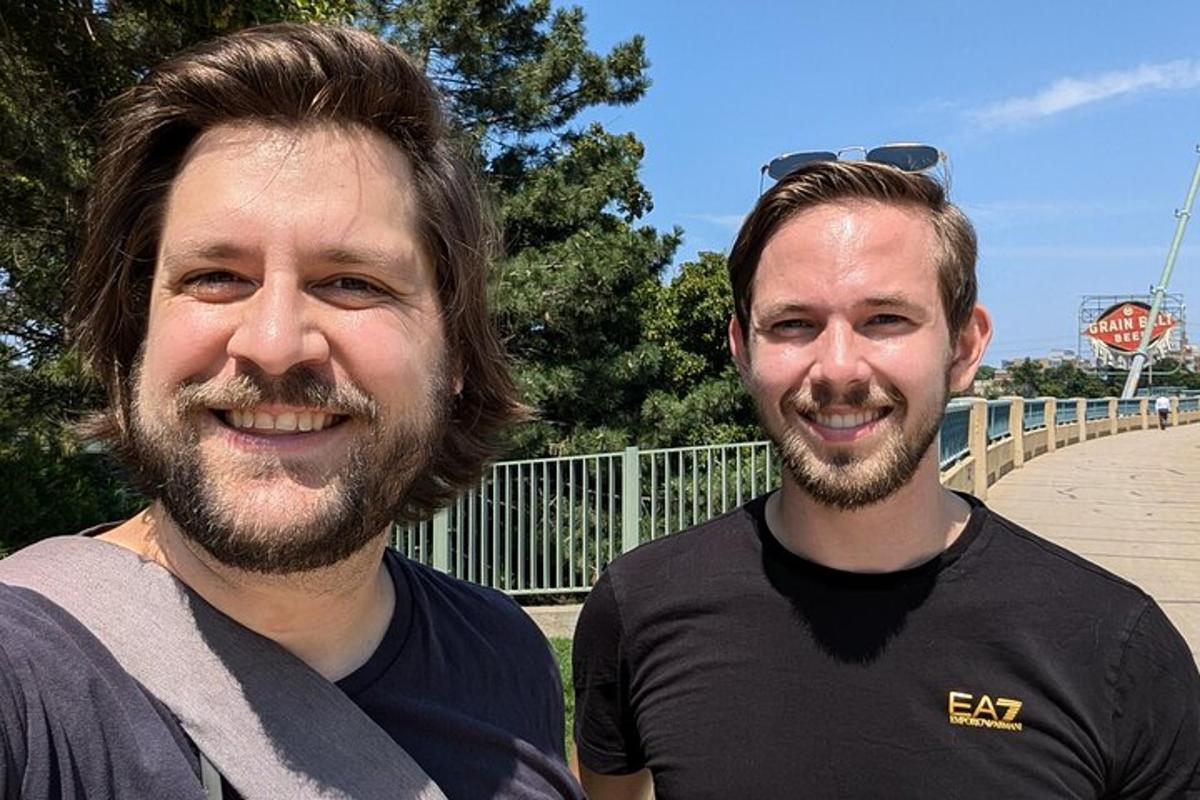 two men are standing next to each other
