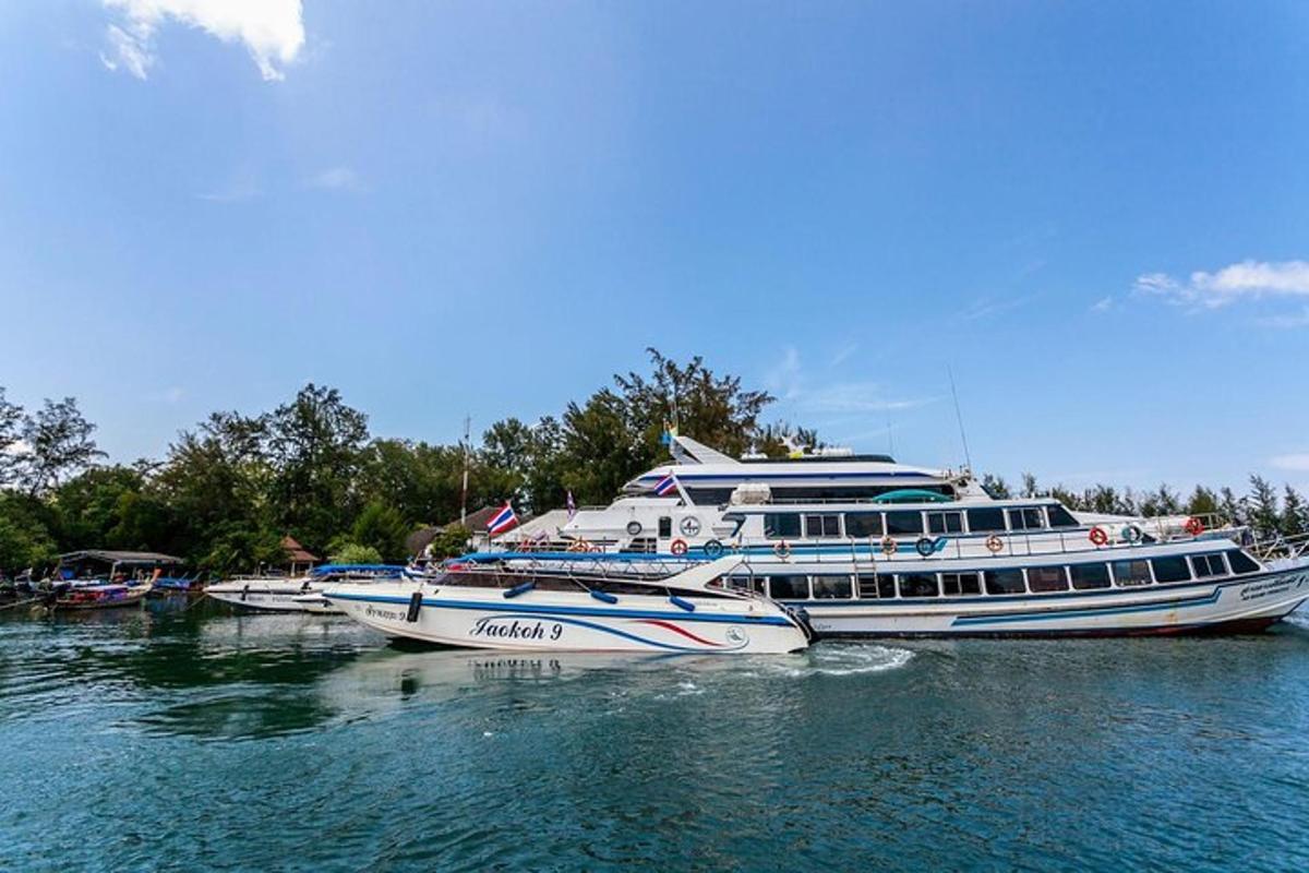 three boats are docked in the water