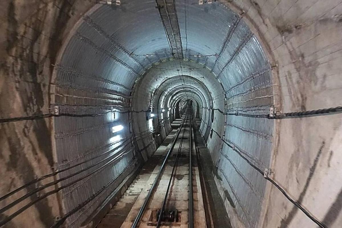 a tunnel with a train track in it