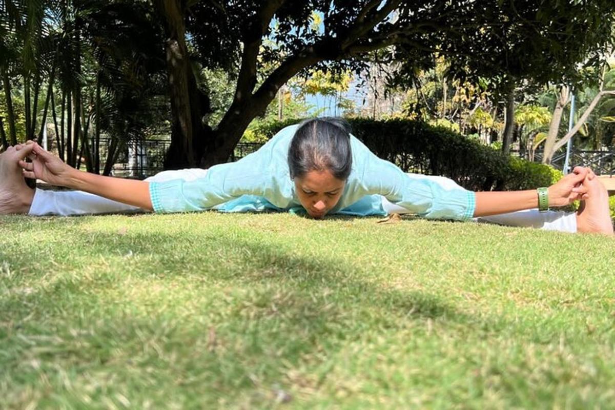 a woman laying on the grass in the grass