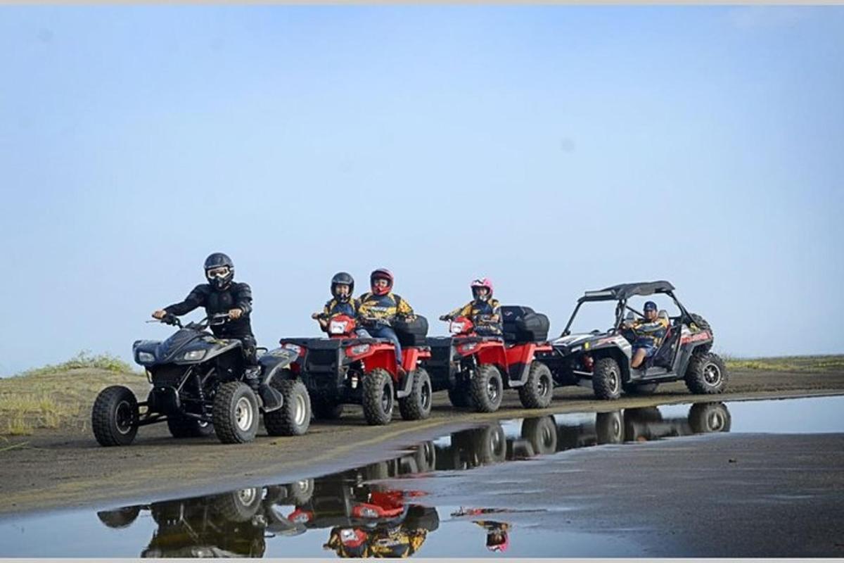 a group of people riding atvs on a bridge