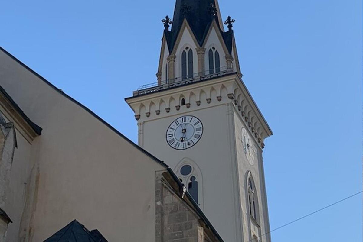 a tower with a clock on the top of a building