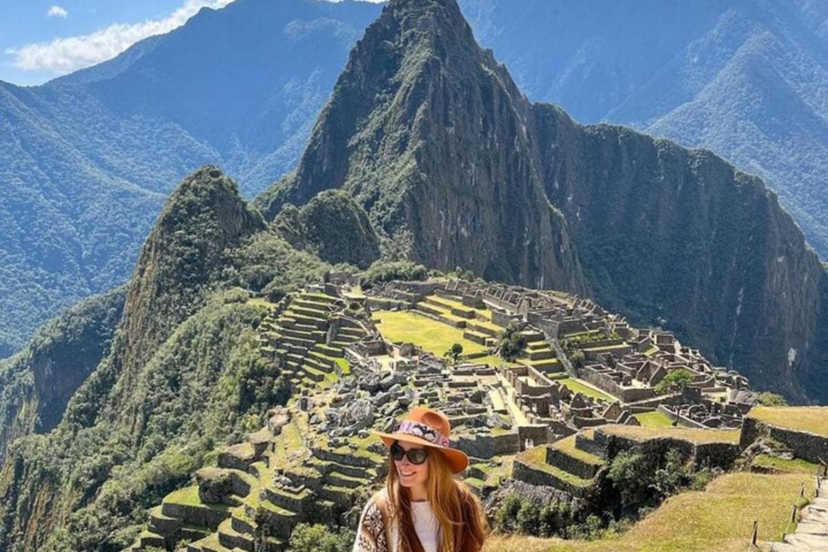 a woman standing on top of a mountain
