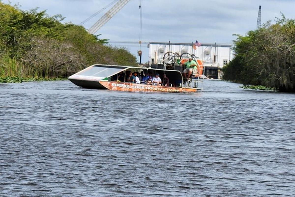 a boat with people on it in a river