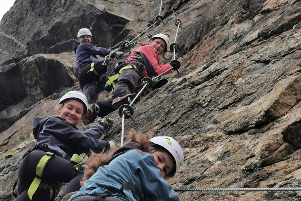 a group of people climbing a rocky mountain